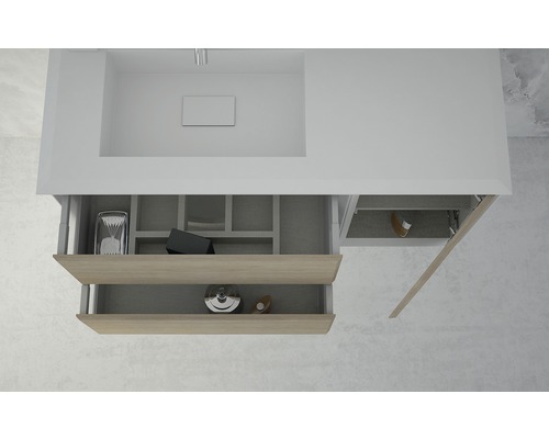 Detaljvy av ett tvättställsskåp med öppna lådor för förvaring av badrumsartiklar