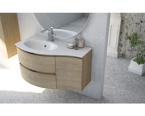 Tvättställ med underskåp, spegel och armatur i badrum