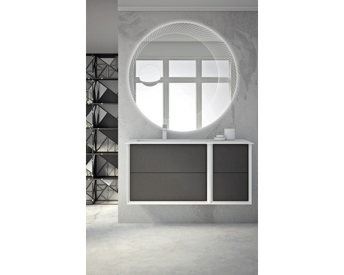 Badrum med tvättställsskåp, tvättställsskål, armatur och rund spegel med belysning