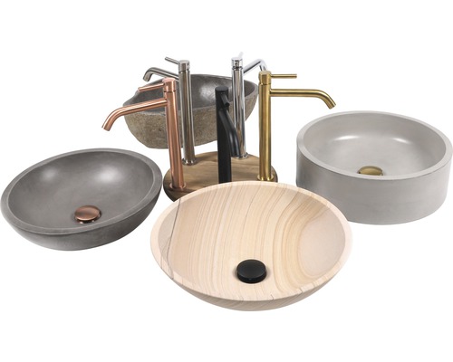 Olika tvättställsskålar och kranar av sten, betong och trä