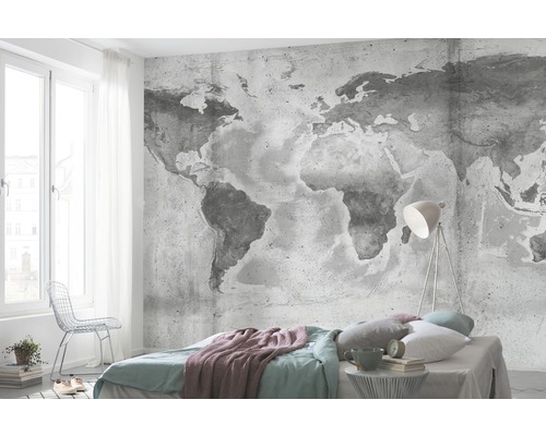 Sovrum med fototapet av världskarta, säng och lampa
