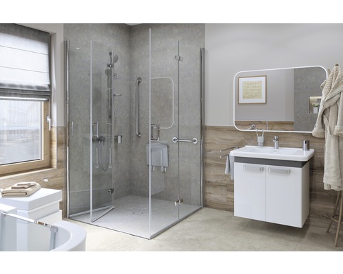 Handikappanpassat badrum med dusch, handtag och tvättställ