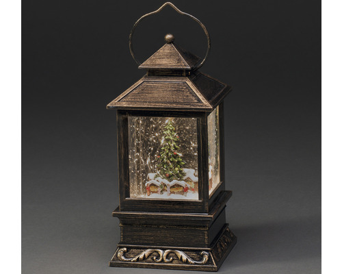 Dekorativ lykta med snökula och julgran