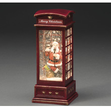 Dekorativt julhus med jultomten i telefonen och texten God Jul