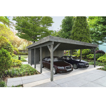 Dubbel carport i trä med två parkerade bilar i trädgården.