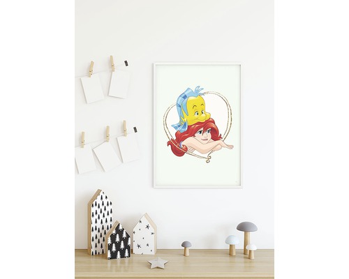 Inramad bild av Ariel och Blunder på ett träbord