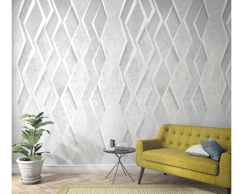 Vardagsrum med tredimensionell diamanttapet, soffa och krukväxt