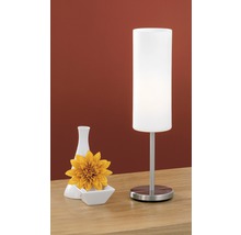 Dekorativ bordslampa med vas och blomma på ett bord