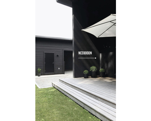 Exteriör av ett modernt hus med träfasad och terrass