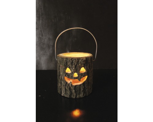 Halloweendekoration av trä med handtag och snidat ansikte