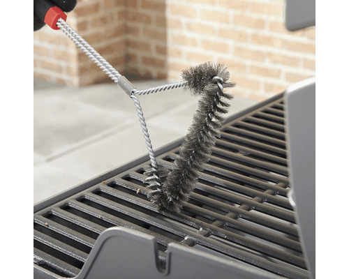 Grillborste rengör ett grillgaller