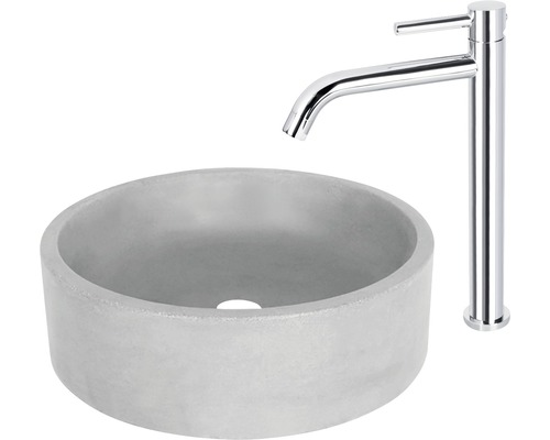 Rund handfat av betong med kromad armatur