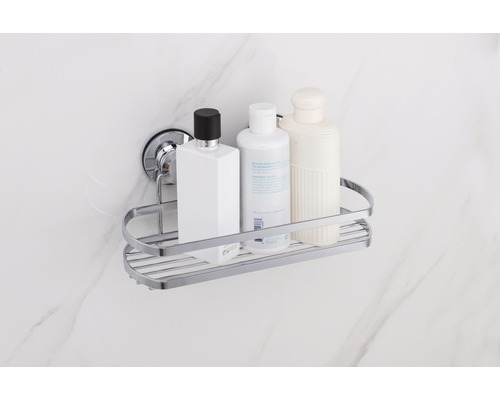 Hörnshylla med sugproppsfäste i badrummet med schampoflaskor