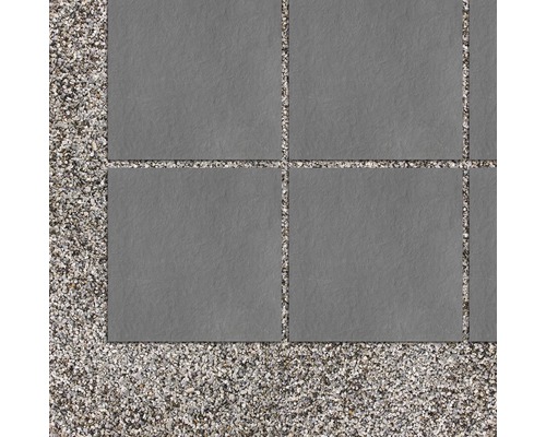 Grå terrassplattor på grusbädd