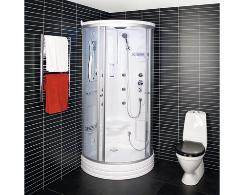 Duschkabin med handdukstork och toalett i ett badrum med mörka plattor