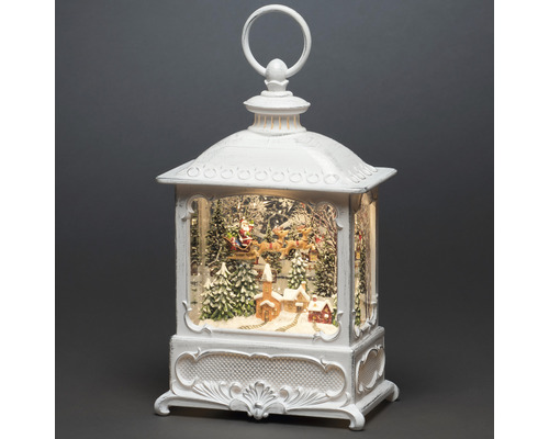 Dekorativ jullykta med jultomten i släde och vinterlandskap