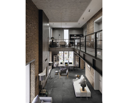 Rymligt vardagsrum med högt i tak, tegelväggar och modern inredning