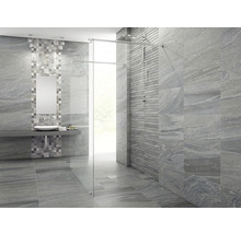 Modernt badrum med grå kakel och duschkabin