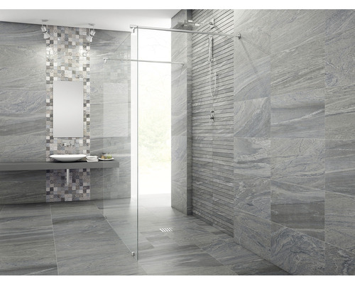 Modernt badrum med grå kakel och duschkabin