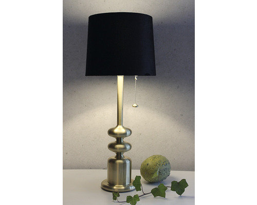 Dekorativ bordslampa med svart lampskärm och gyllene fot