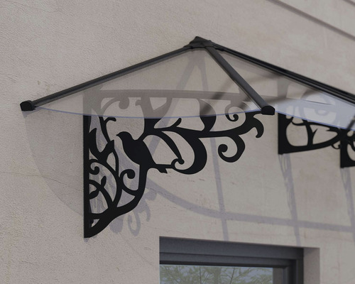 Tak med fågelmotiv monterad på en husvägg