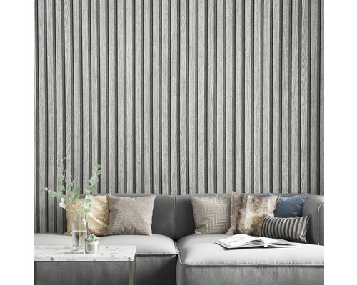 Vardagsrum med grå träpanelvägg och grå hörnsoffa