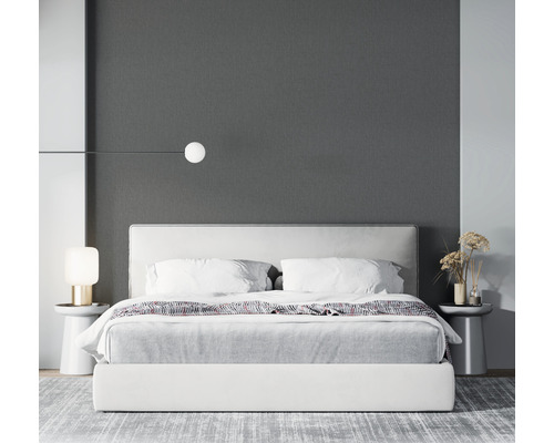 Modernt sovrum med säng, sängbord och belysning