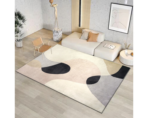Vardagsrum med matta med abstrakt mönster, soffa och fåtölj