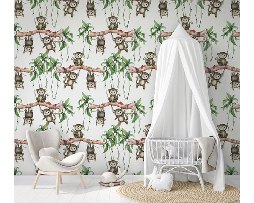 Barnrum med tapet med apor, spjälsäng och fåtölj