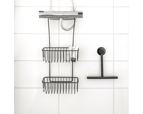 Duschhylla med två hyllor och duschskrapa på en kakelvägg