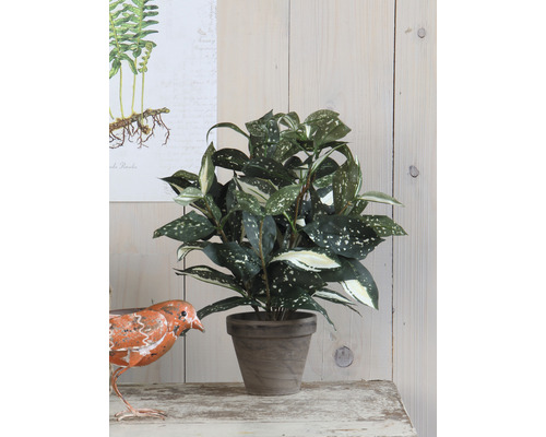 Konstgjord växt i kruka som bordsdekoration