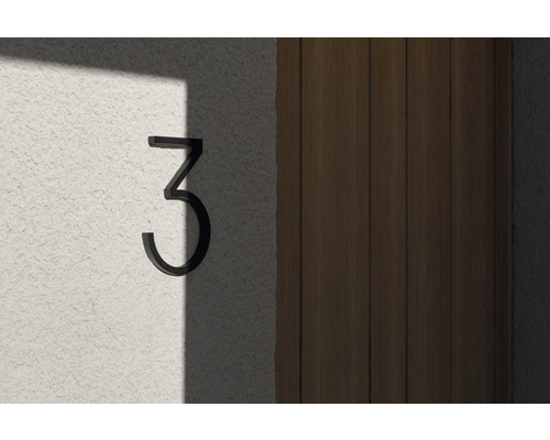 Husnummer 3 på en vägg