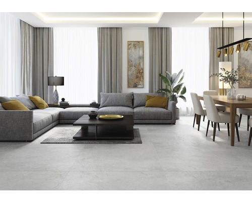 Vardagsrum med grå hörnsoffa, soffbord, matbord och stolar