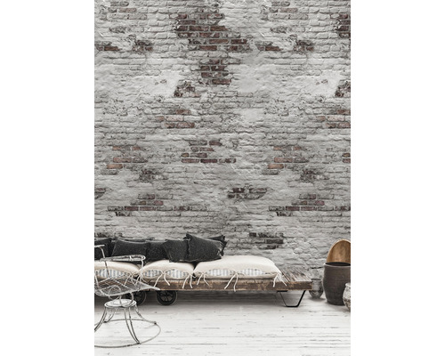 Dekorativ scen med sittgrupp och tegelvägg