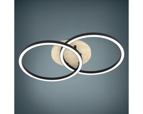 Taklampa med två sammanflätade ringar och ett runt träfäste.