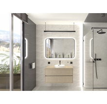 Modernt badrum med tvättställ, spegel med belysning och duschkabin