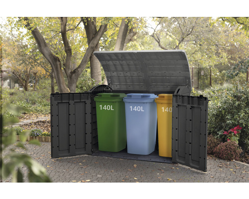 Soptunnebox med tre soptunnor i trädgården