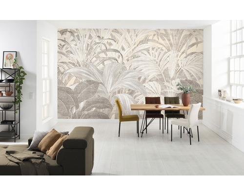 Vardagsrum med fototapet med växtmotiv, matbord och soffa