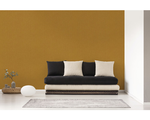 Vardagsrum med futon, kuddar och matta