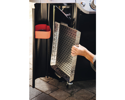 Insats i rostfritt stål för en gasolgrill sätts in