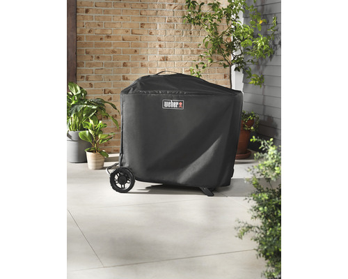 Övertäckt grill med Weber-logotyp