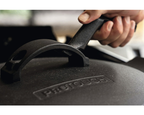 Gjutjärnslock med handtag