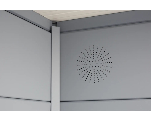 Detaljvy av en trädgårdshusvägg med ventilationshål