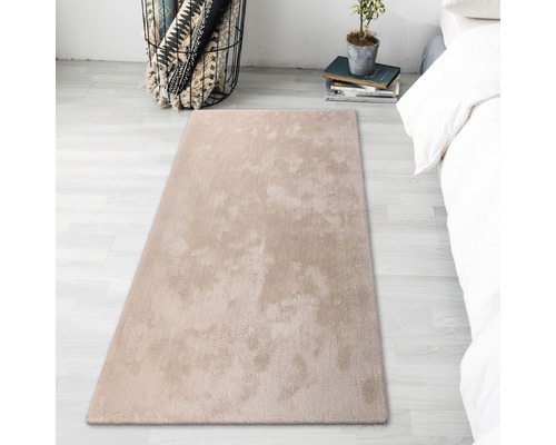 Beige matta i sovrummet