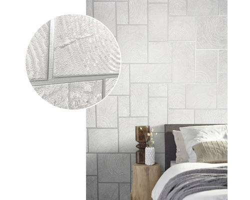 Miljöbild med en vit tapet med träblocksmönster i ett sovrum