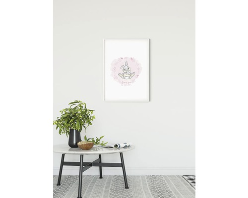 Dekorativ fotoram med kaninmotiv på väggen