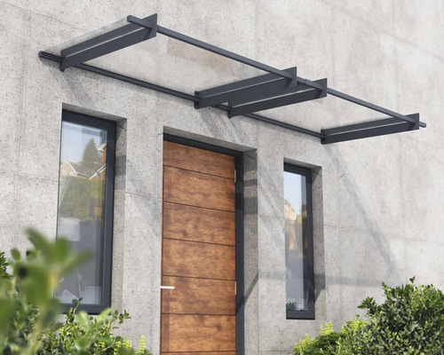 Dörrtak av glas och metall på en husfasad