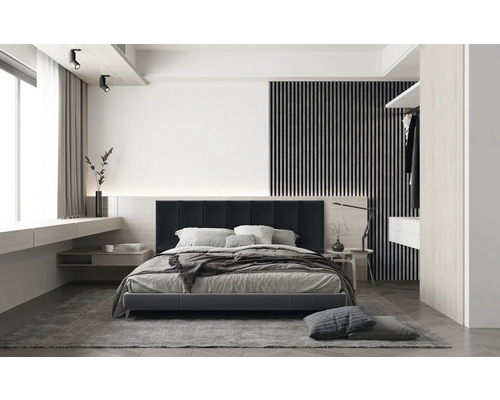 Sovrum med säng, nattduksbord och belysning