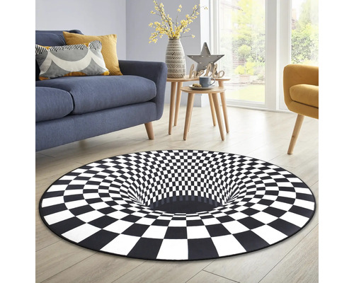 Vardagsrum med blå soffa och matta med schackrutigt mönster