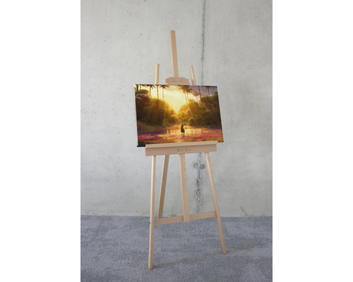 Målad tropisk landskapsbild på staffli